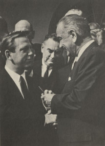 President Lyndon Johnson gives Brademas the pen he used to sign into law the bill that created the NEA and NEH.