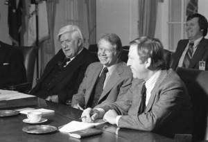 Both President Jimmy Carter (center) and Brademas (right) would lose in the Reagan wave of 1980. Speaker Tip O'Neill is seated on the left.